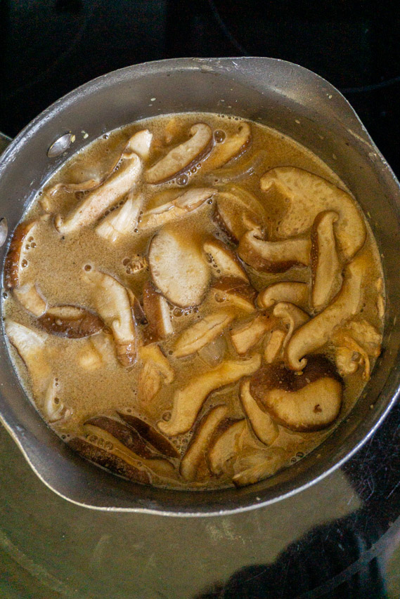 add the sliced mushrooms to the broth