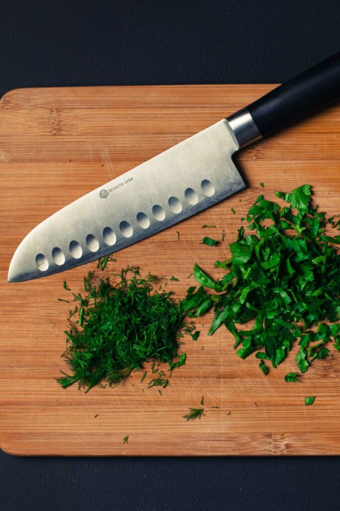 santoku knife and herbs
